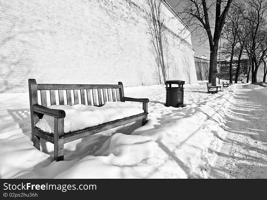 Bench in winter in castle park. Bench in winter in castle park.