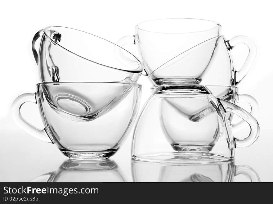 6 glass tea cups with reflection on white at 10Mps. 6 glass tea cups with reflection on white at 10Mps