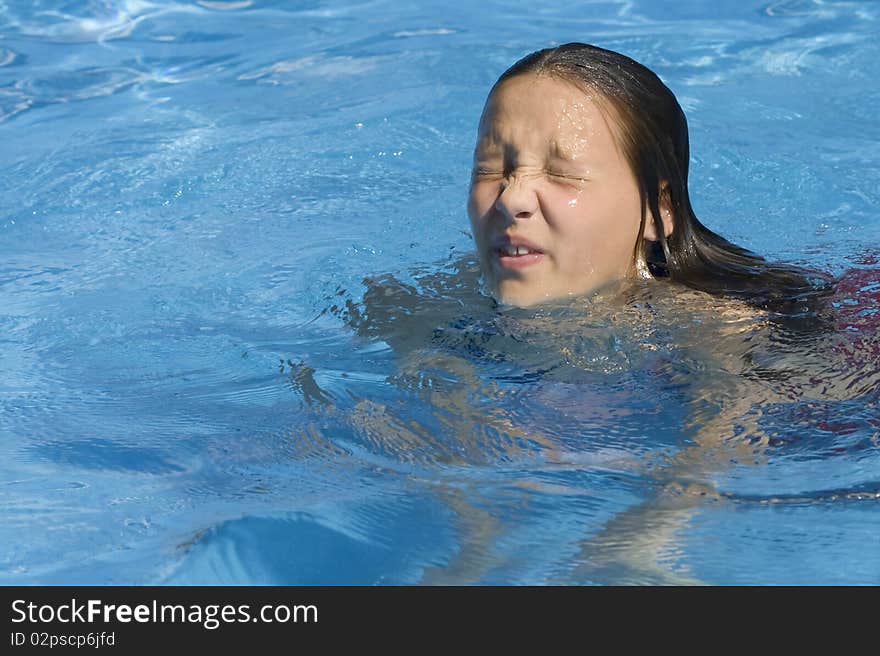 Squinting Girl In Pool