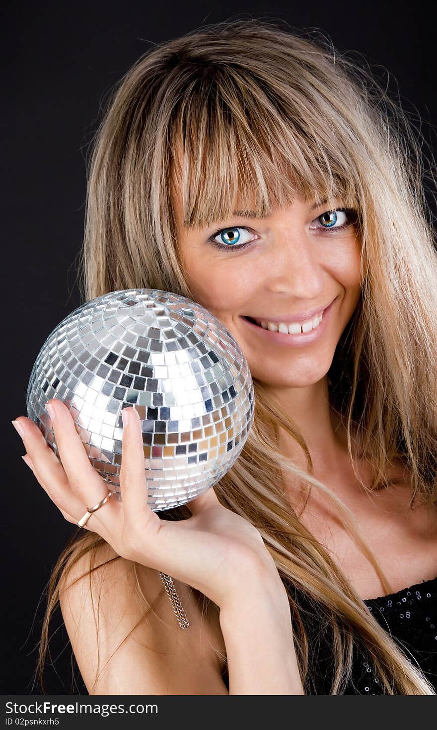 Smiling blonde holding a sphere