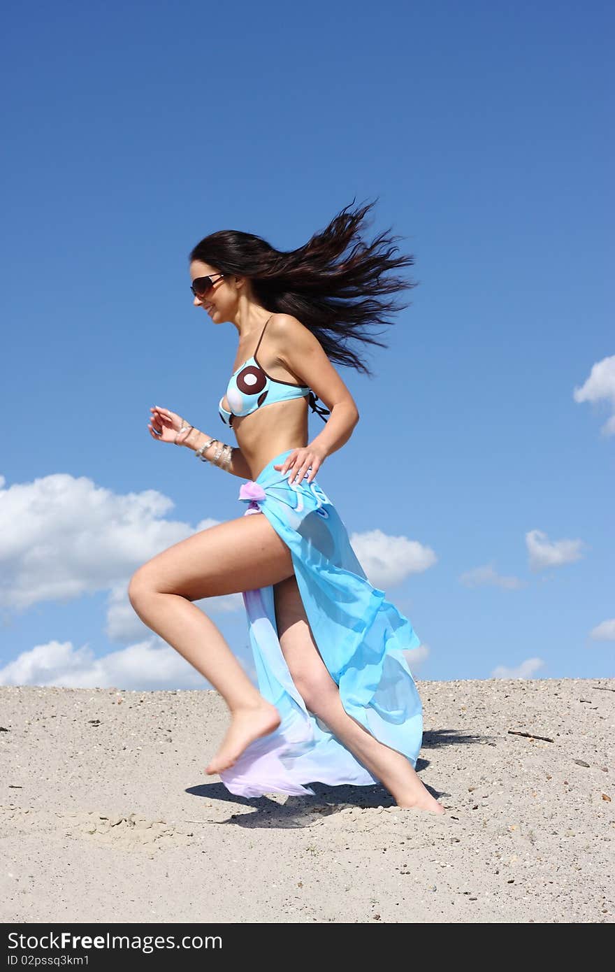 Summer happy girl running on the beach. Summer happy girl running on the beach