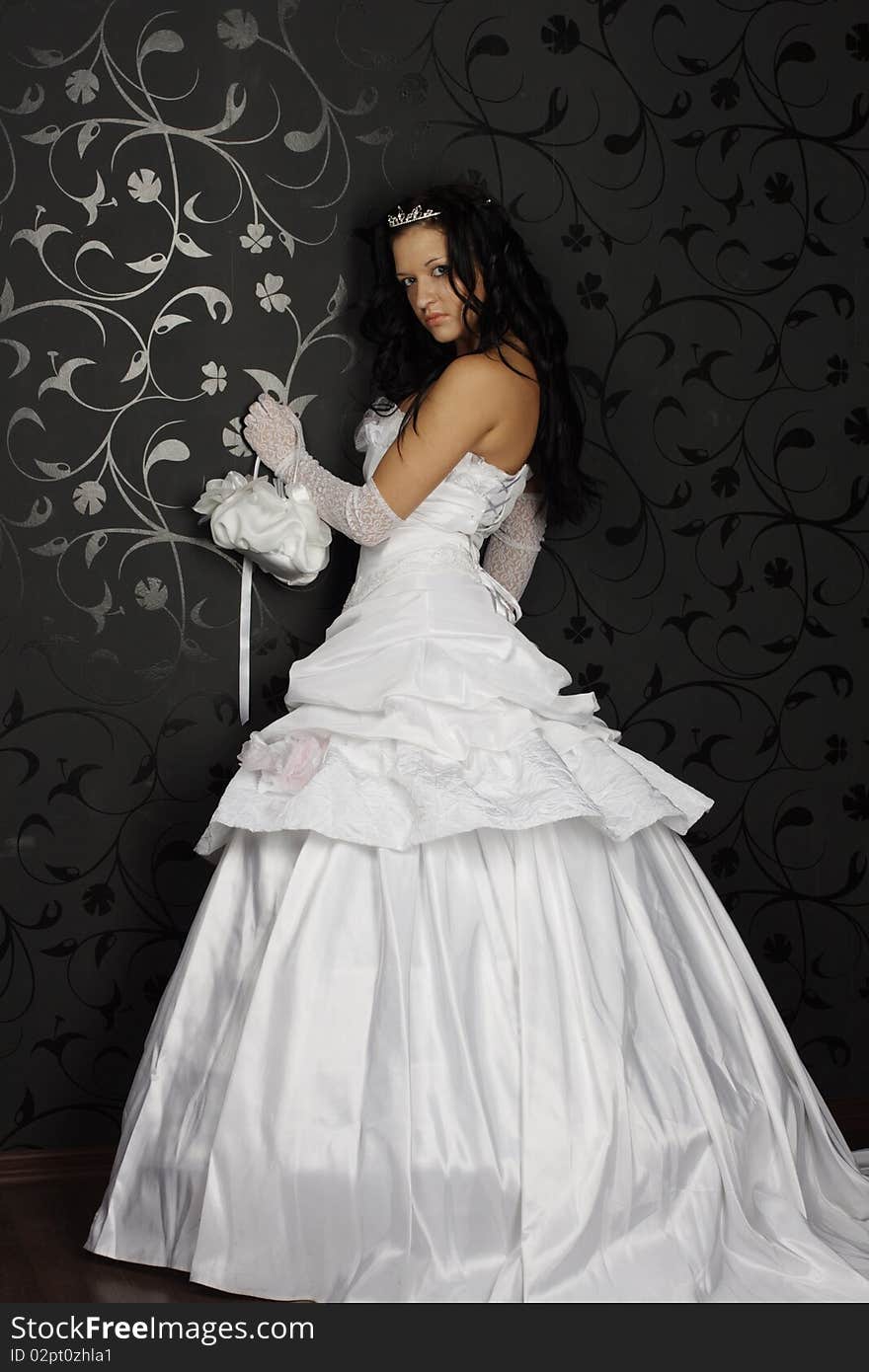 Portrait of beautiful happy bride in a wedding dress on black background studio shot. Portrait of beautiful happy bride in a wedding dress on black background studio shot