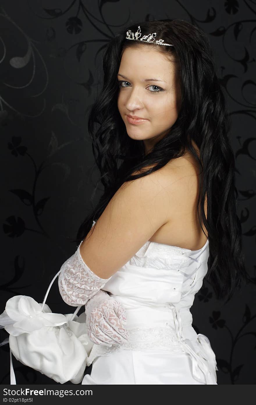 Portrait of beautiful happy bride in a wedding dress on black background studio shot. Portrait of beautiful happy bride in a wedding dress on black background studio shot