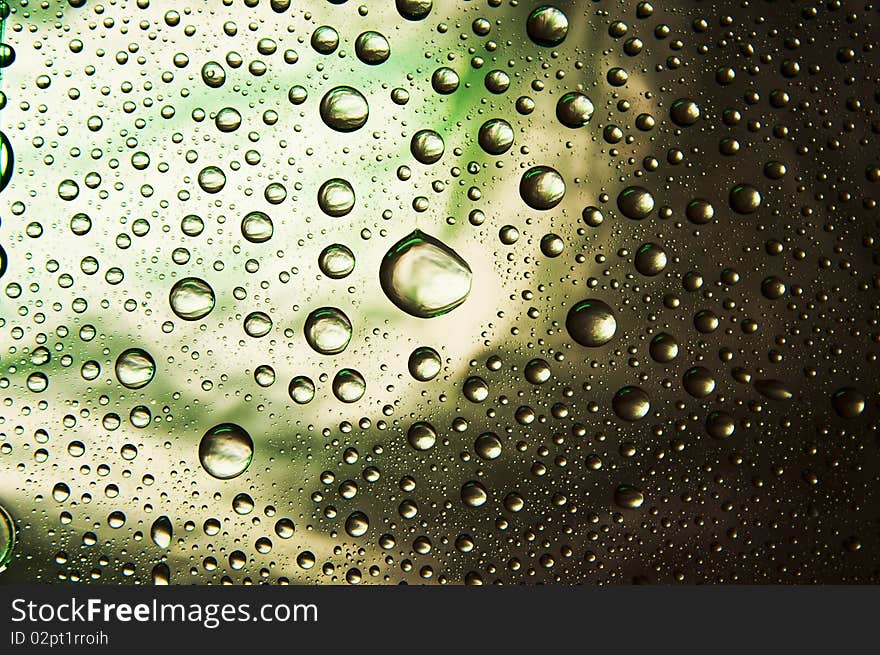 Many water drops (green, yellow, black, ect)