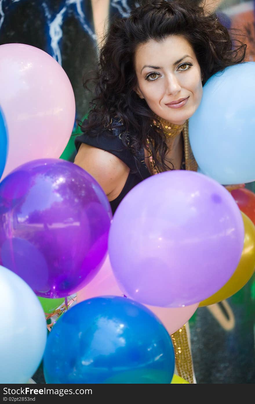 Happy woman with colorful balloons