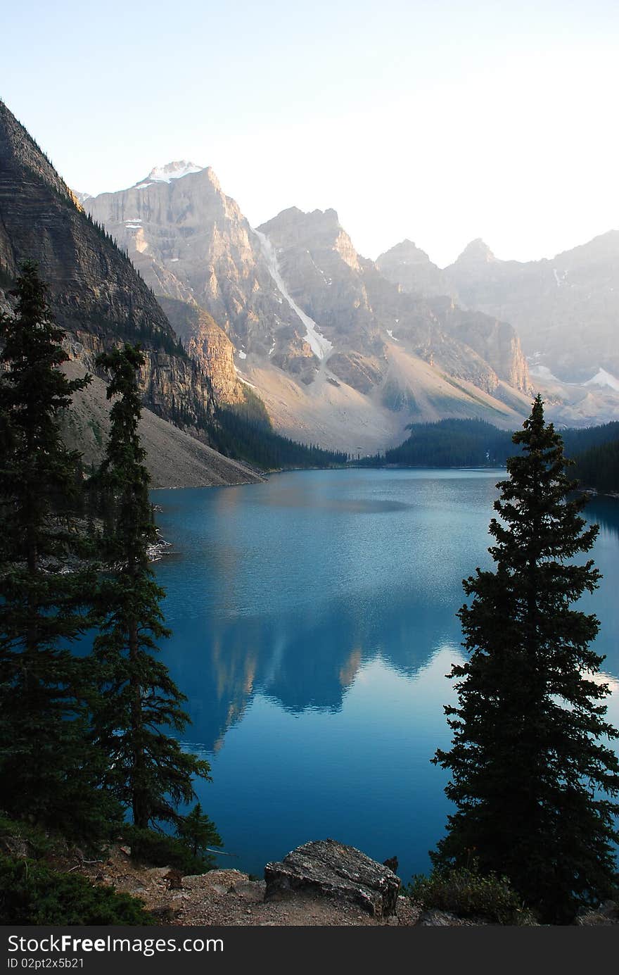 This is Beautiful Moraine Lake in The Canadian Rockies.  This glacier lake gets its crystal blue water look from silt on the bottom.