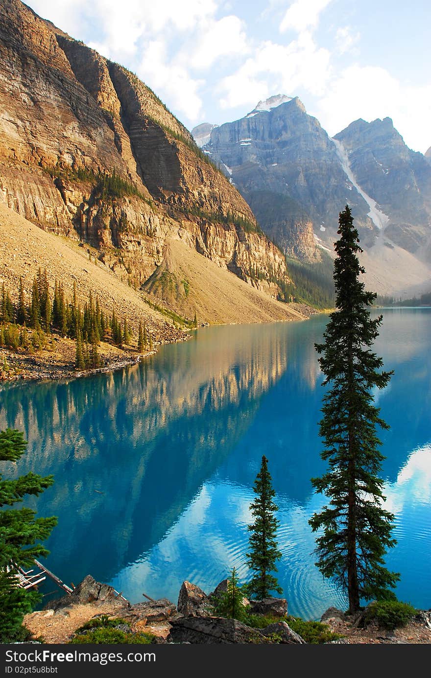 This is Beautiful Moraine Lake in The Canadian Rockies.  This glacier lake gets its crystal blue water look from silt on the bottom.