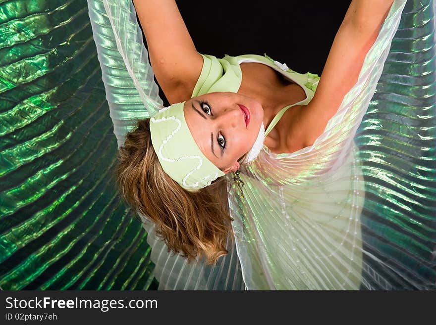 Beautiful belly dancer woman in front of black background