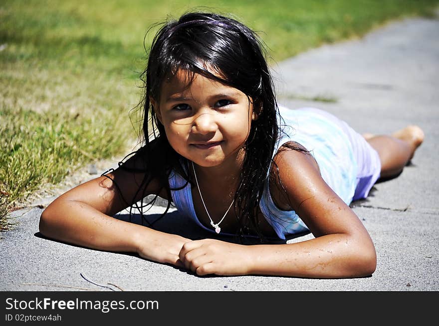 Child on the ground after swimming. Child on the ground after swimming