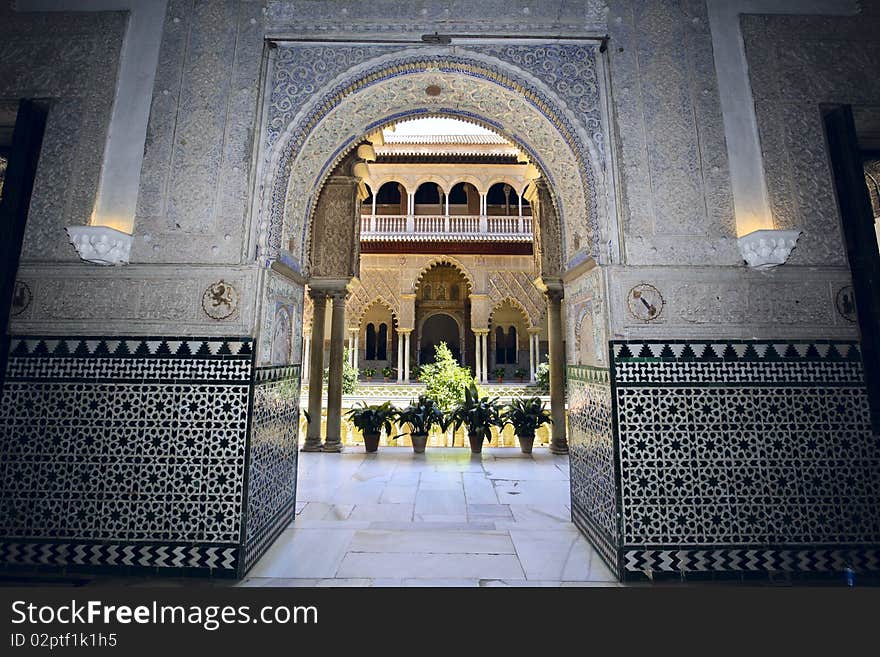 Arches, pillars and marble hallways of the Alcazar in Seville, Spain. Arches, pillars and marble hallways of the Alcazar in Seville, Spain.