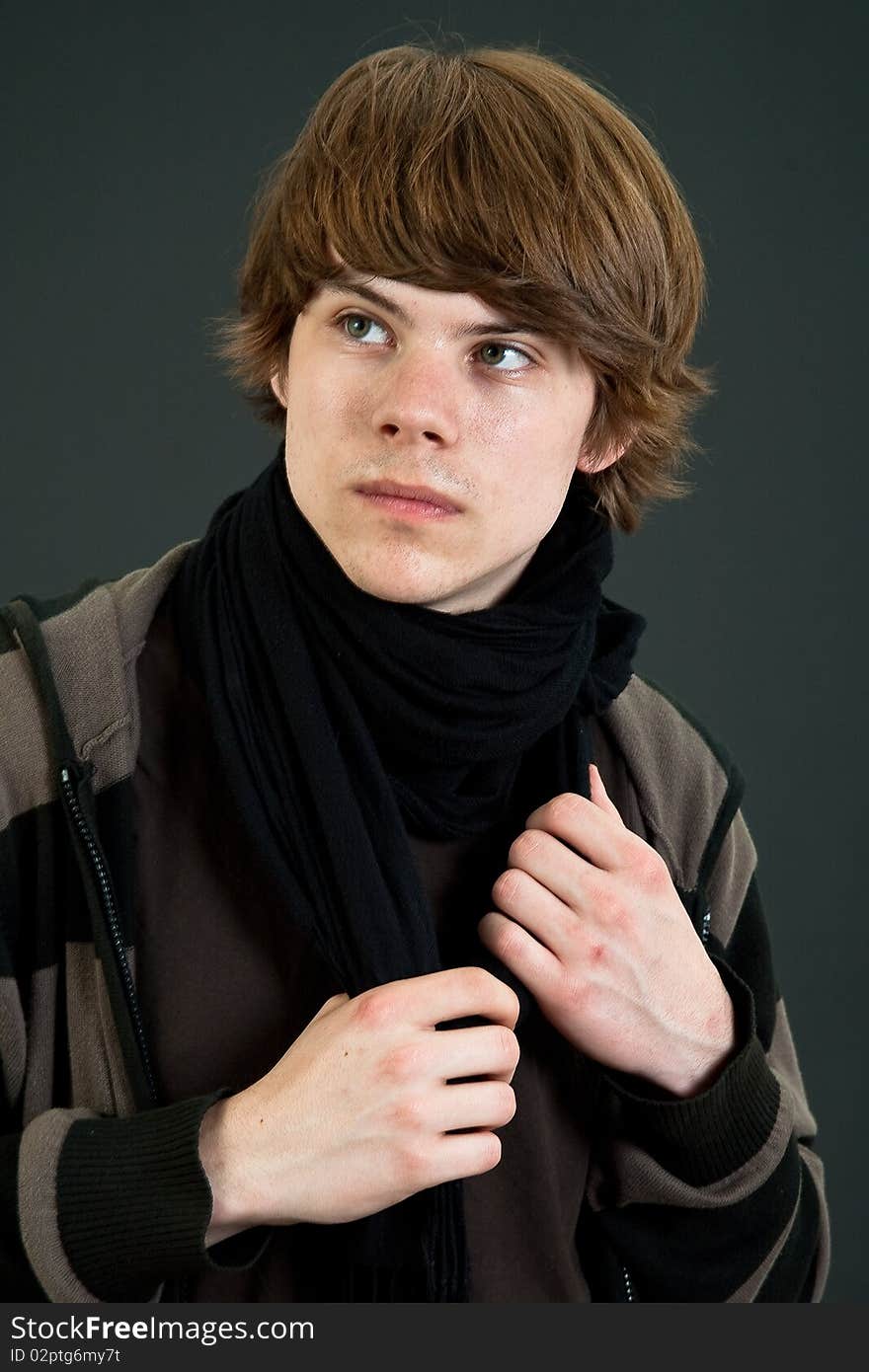 Portrait of cool teenager male over dark background. Portrait of cool teenager male over dark background