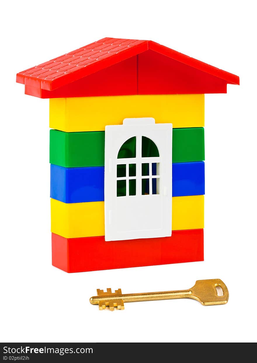 Toy house and key isolated on white background