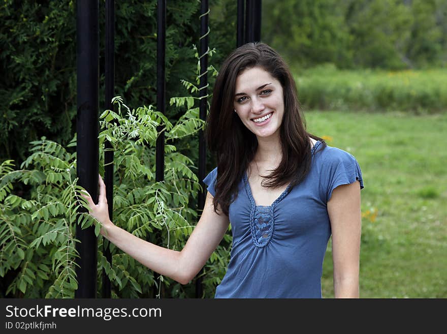 Young woman smiling in a nature area