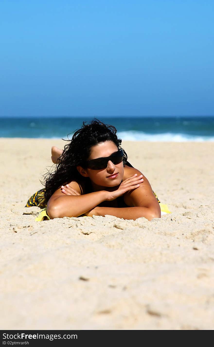 Beautiful brunette on the beach