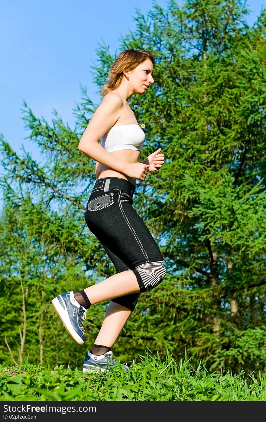 Girl running in forest