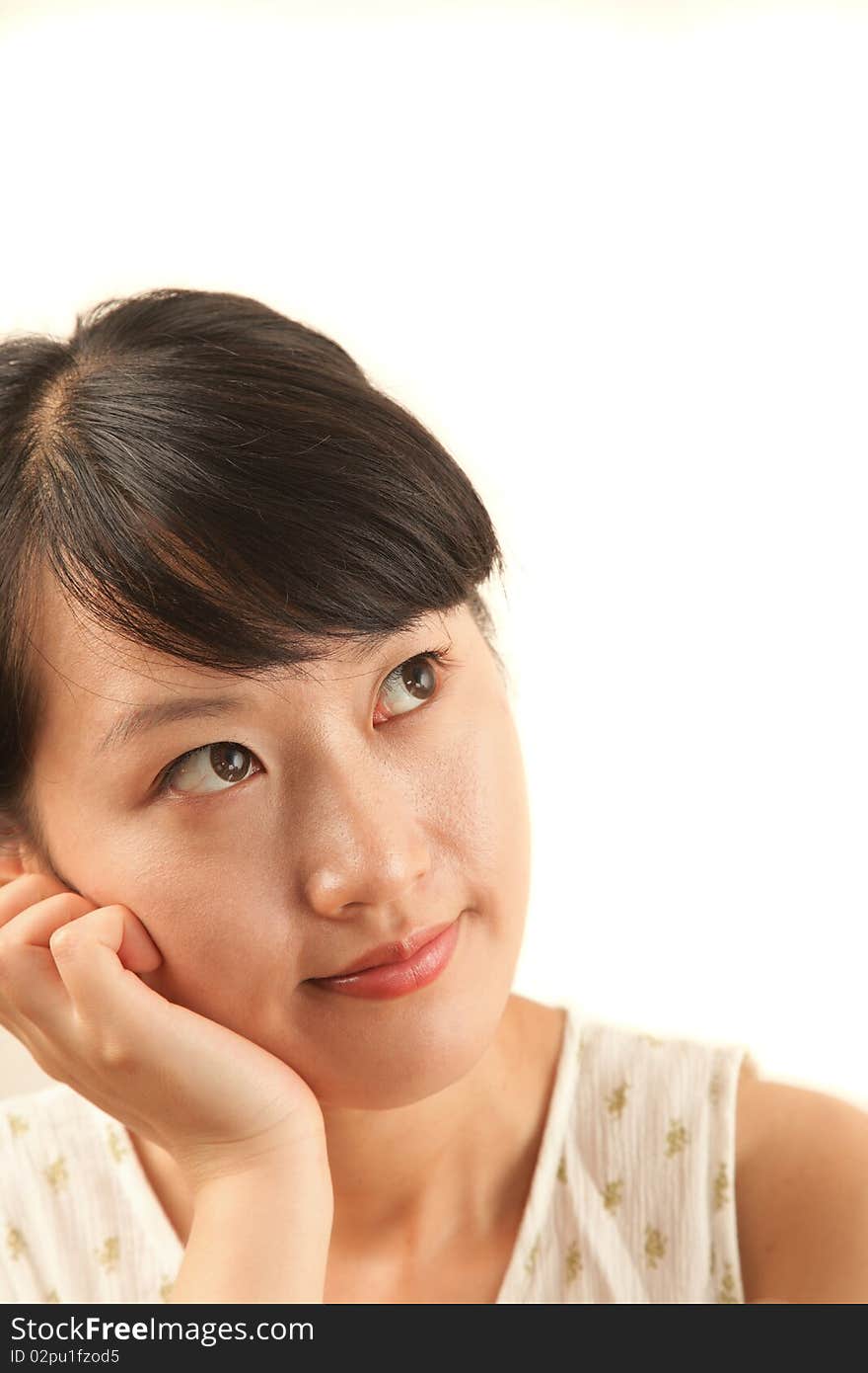 Portrait of young beautiful woman looking up