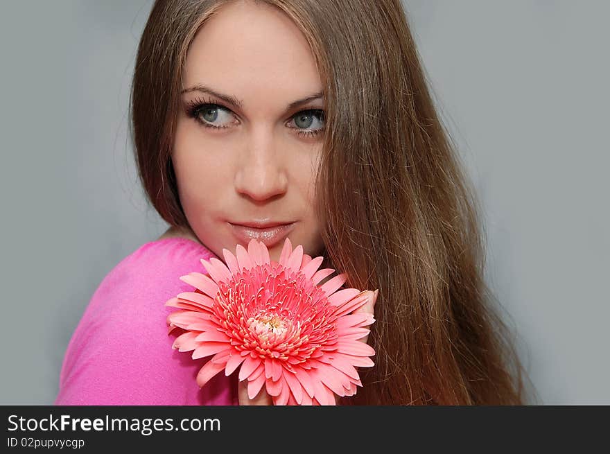 Portrait of young woman with flower. Portrait of young woman with flower