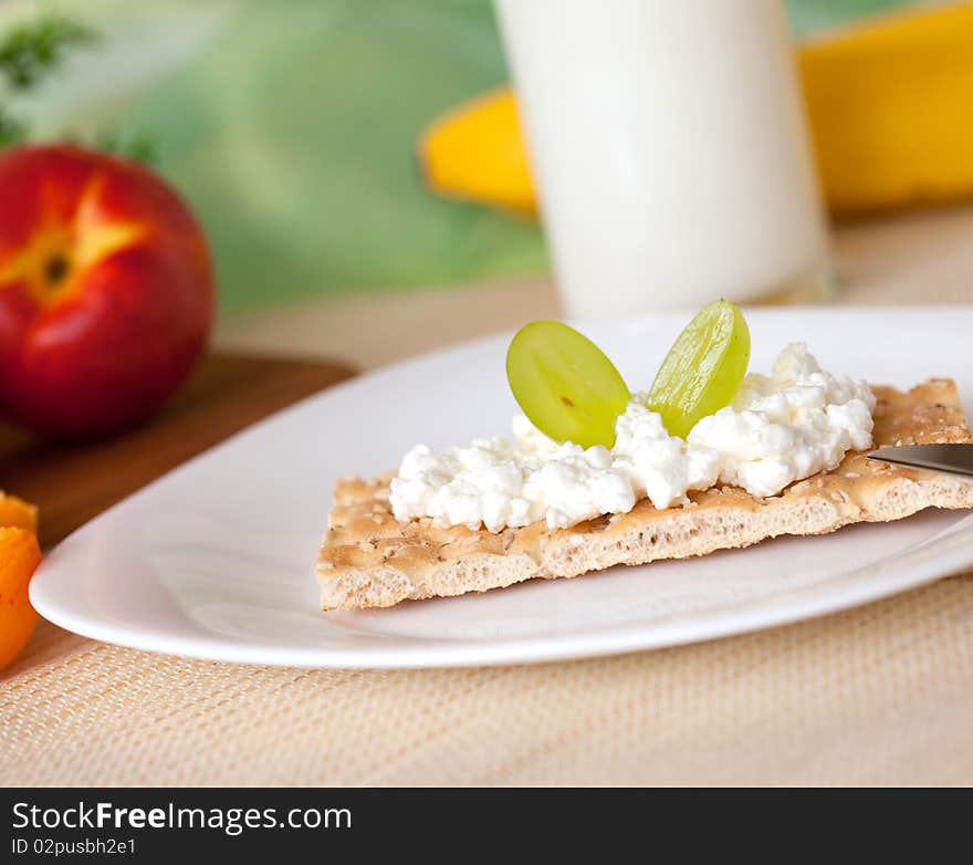 Crispbread on a plate with cottage cheese. Crispbread on a plate with cottage cheese