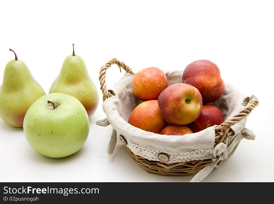 Nectarines in the basket with pear and apple