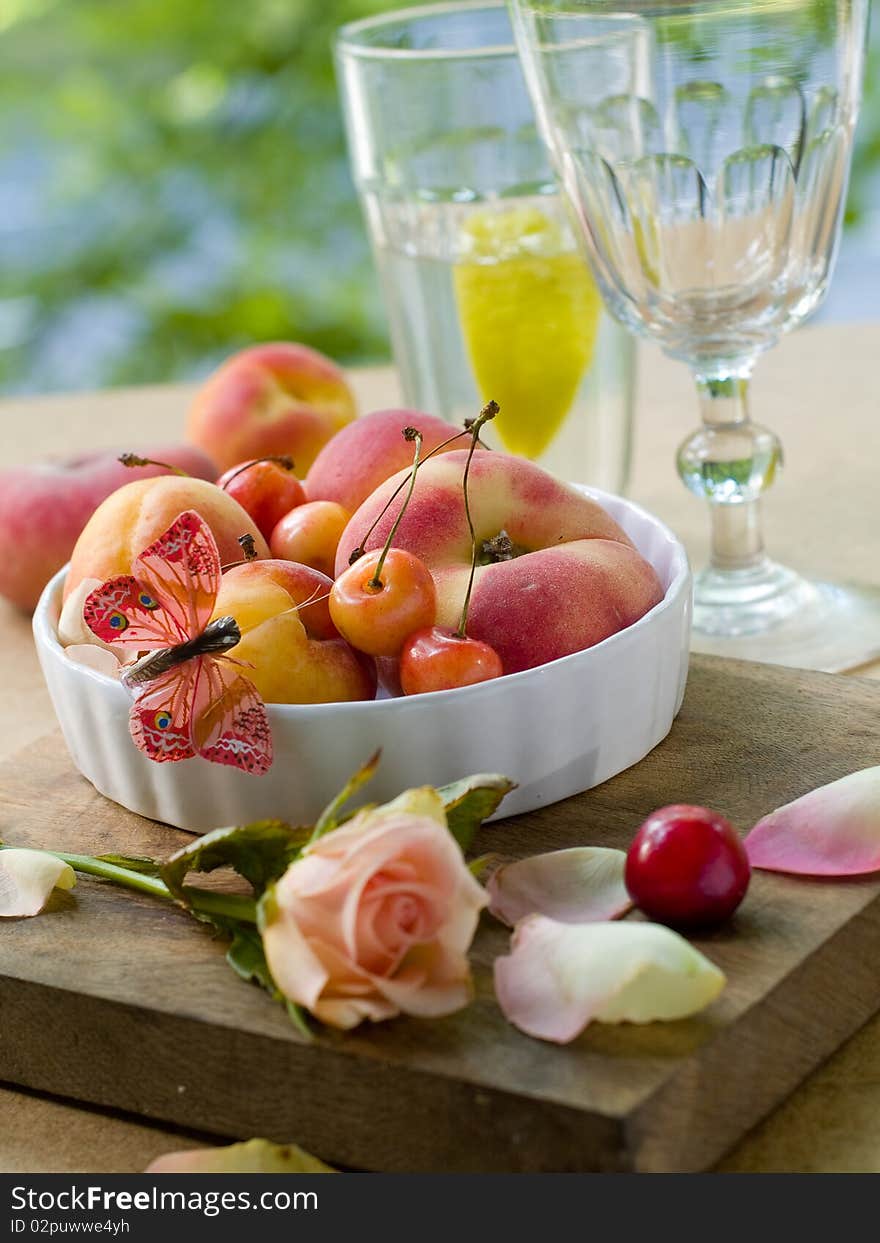 Fresh Fruits In Bowl With Butterfly