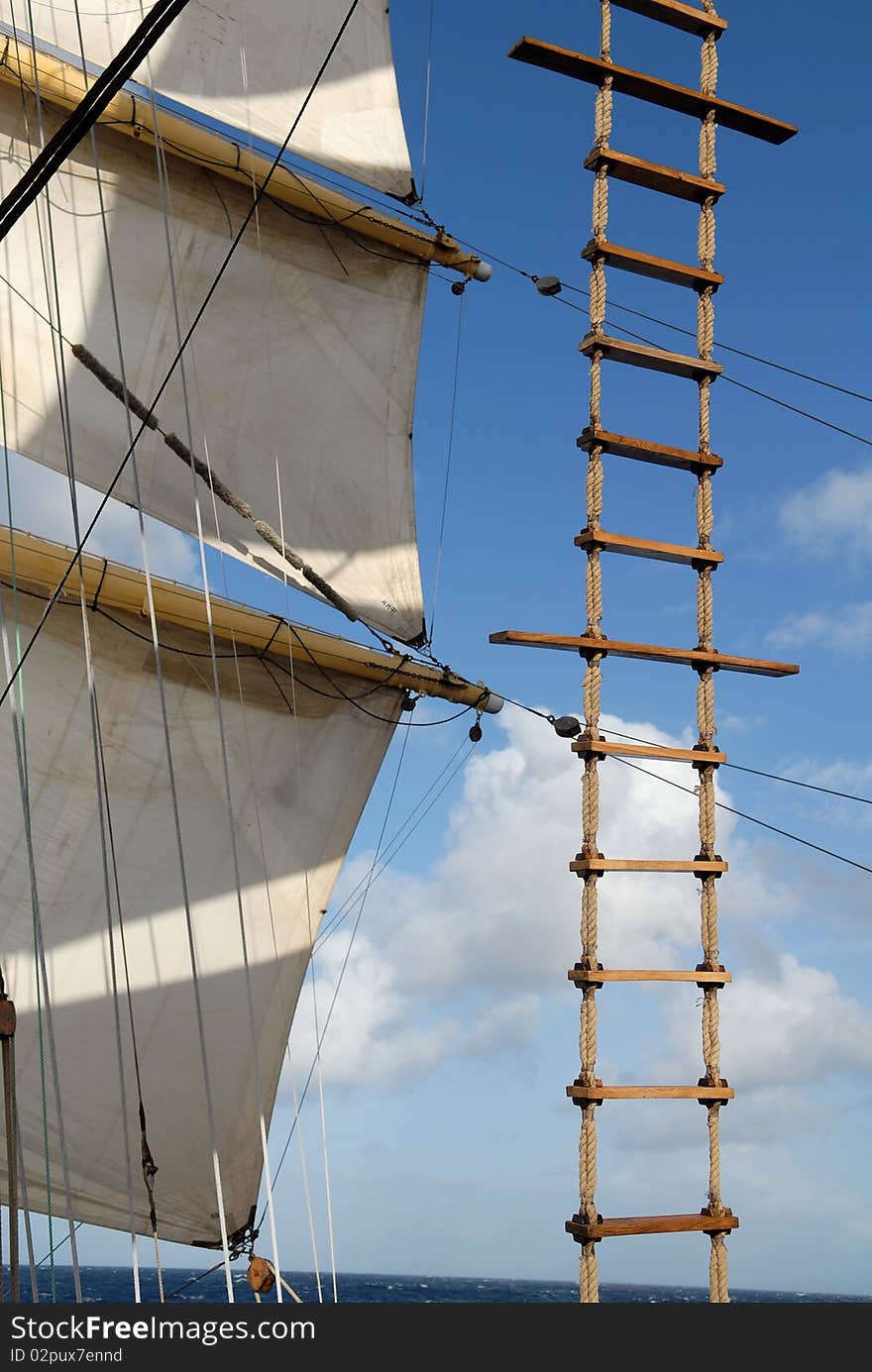 Wooden ladder against the sky and sails. Wooden ladder against the sky and sails