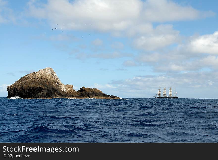 The sailing ship against islands