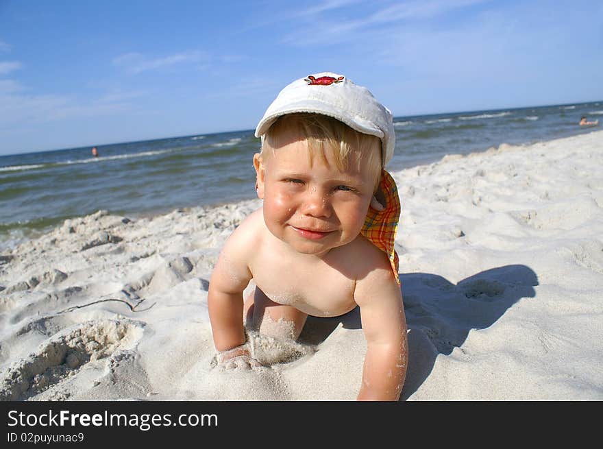 Small boy over sea, fun on beach