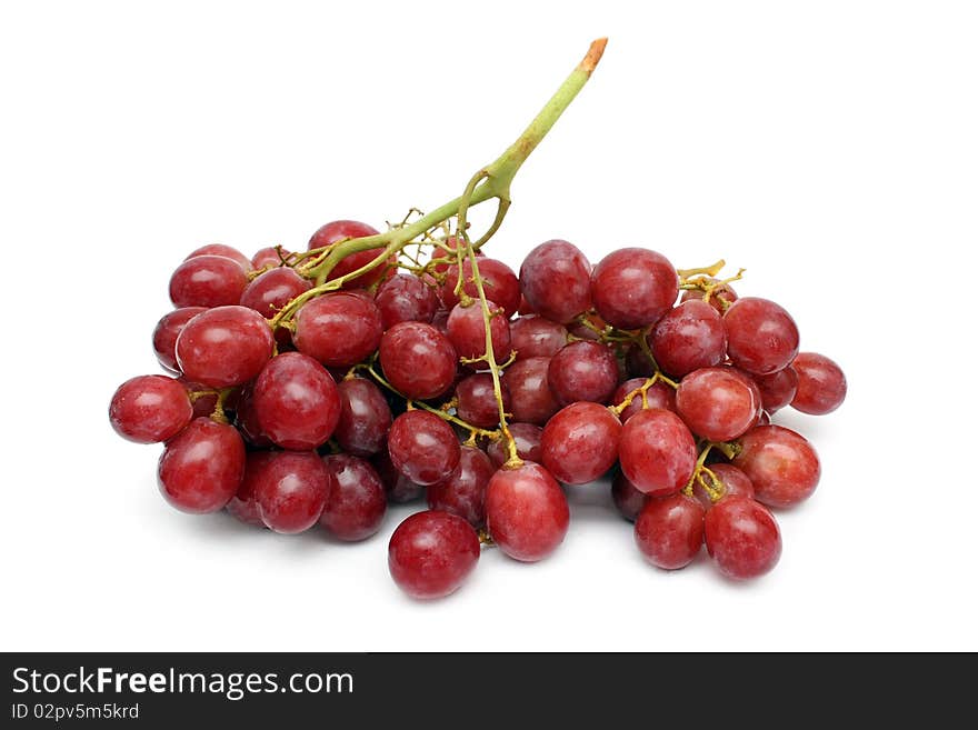 A string of red grape isolated on white background.