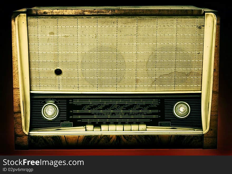 Old russian radio isolated on a dark background. Old russian radio isolated on a dark background