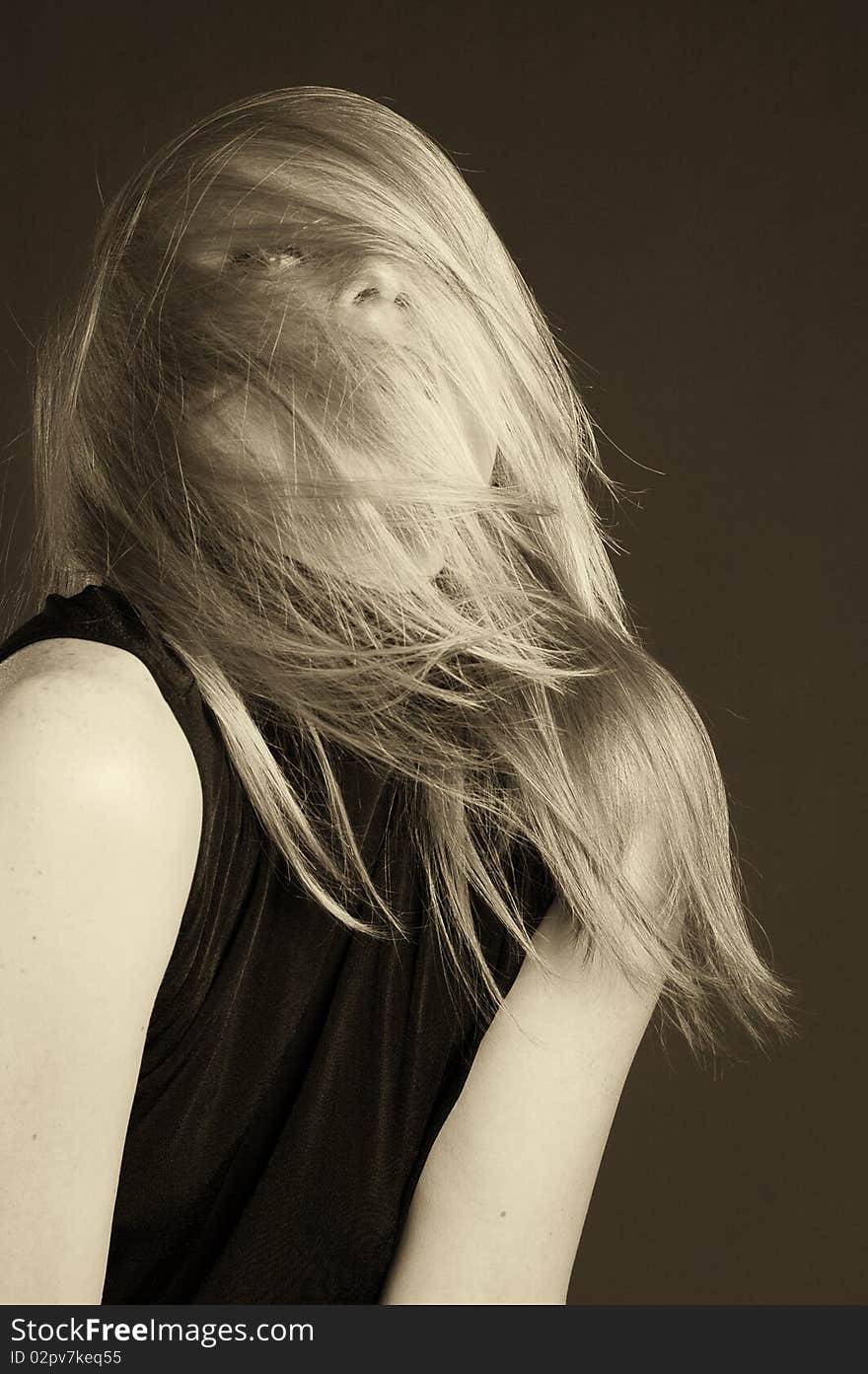 Beautiful blonde girl portrait in a studio