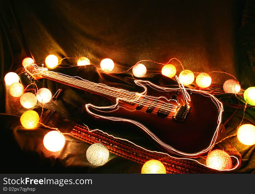 Electric guitar taken using overlay of several slow shutter speed shots while 'painting with light' to create a dazzling light effect. Electric guitar taken using overlay of several slow shutter speed shots while 'painting with light' to create a dazzling light effect.