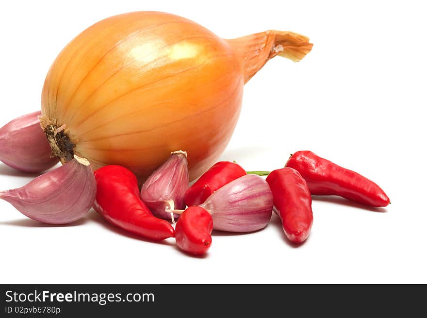 Onion garlic and red pepper on a white background. Onion garlic and red pepper on a white background.