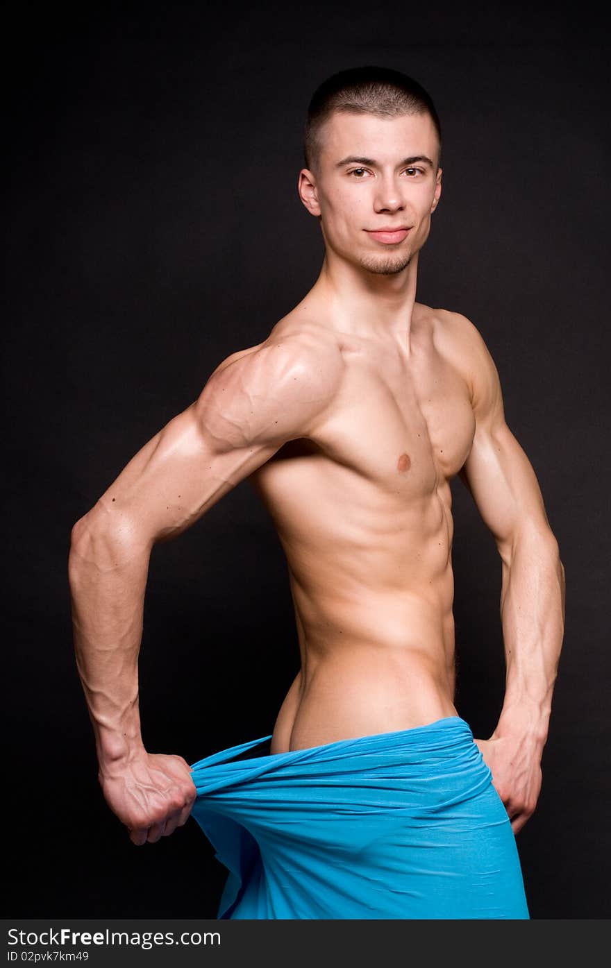 Muscled male model posing in studio