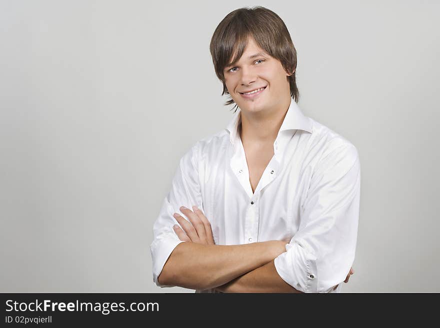 Closeup portrait of a charming young man smiling with copyspace. Closeup portrait of a charming young man smiling with copyspace