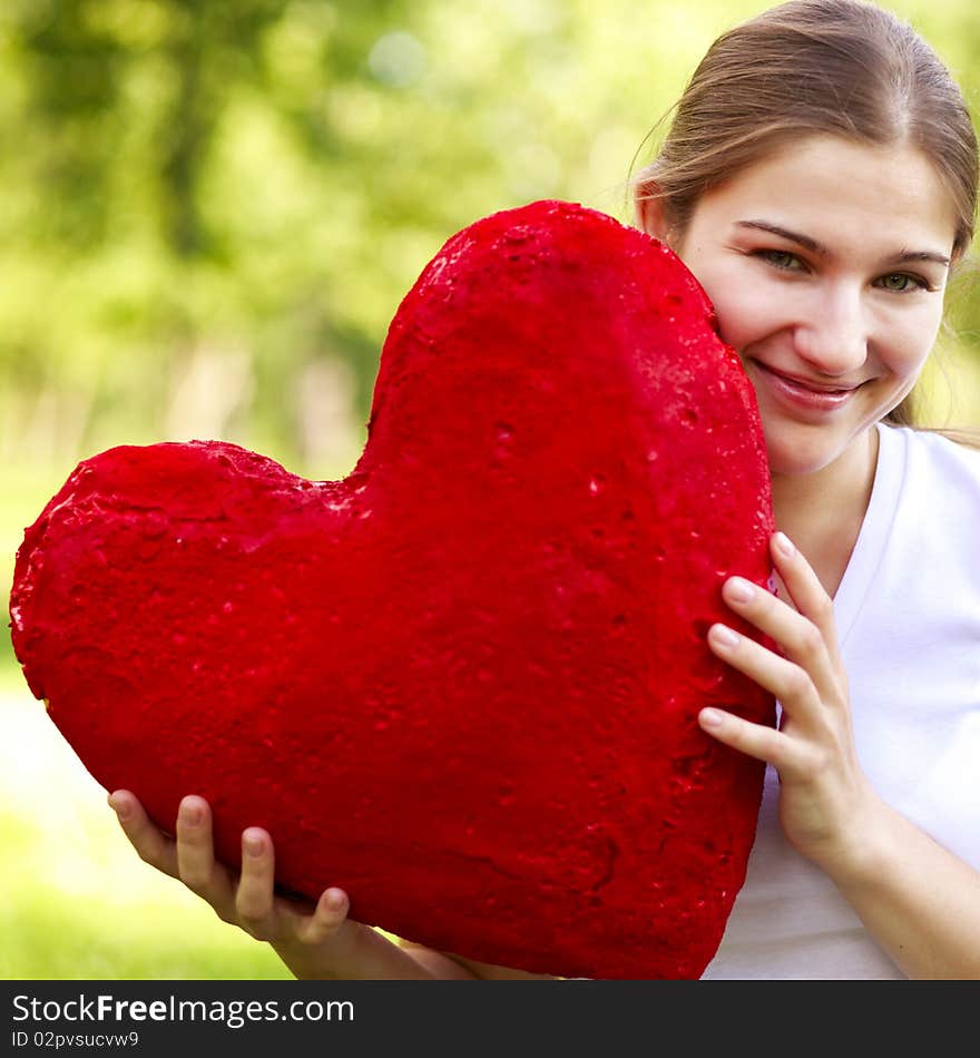 Young Woman Holding Big Red Heart