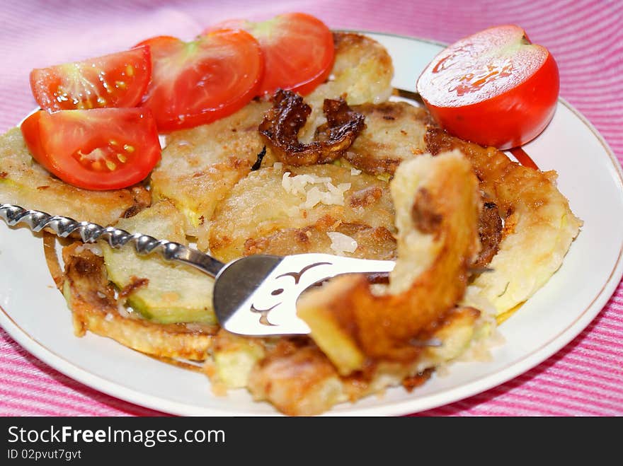 Appetizing fry garden marrow with garlic seasoning