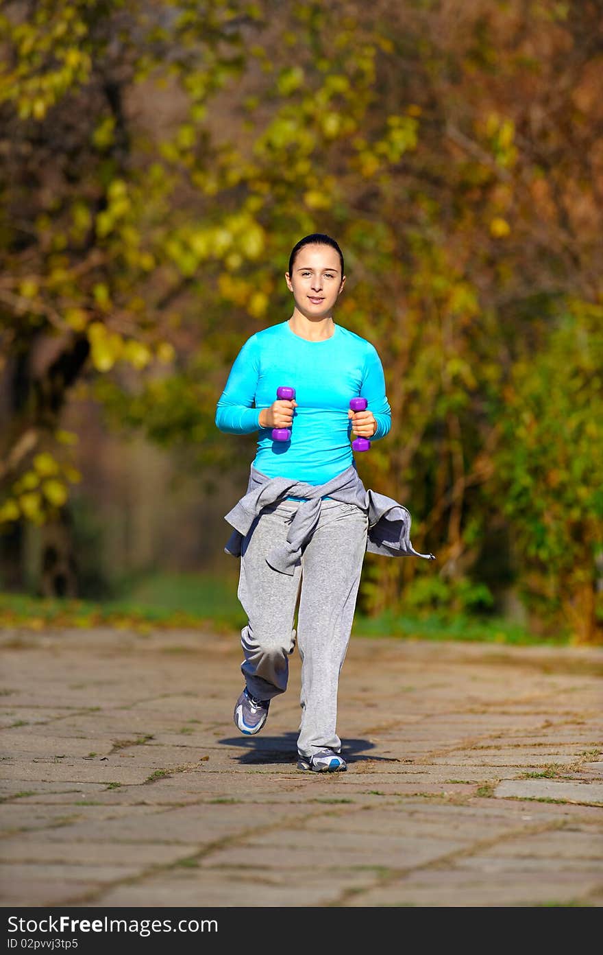 Girl doing exercises in the park