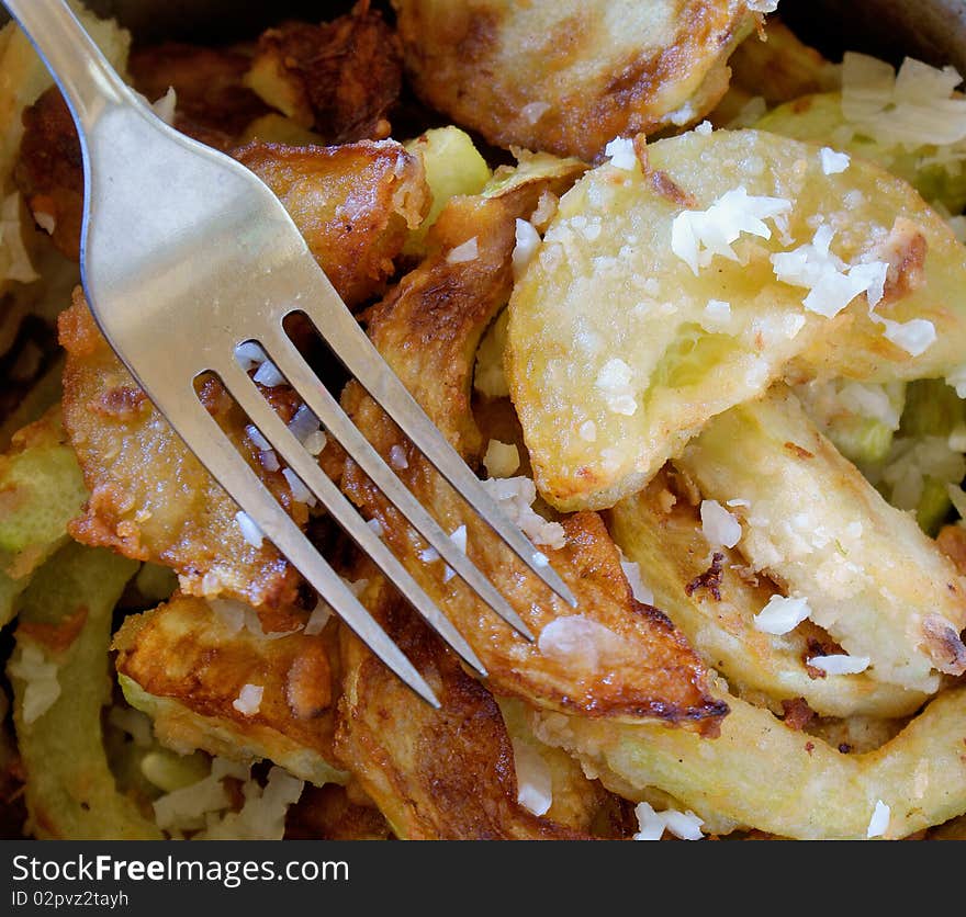 Appetizing fry garden marrow with garlic seasoning