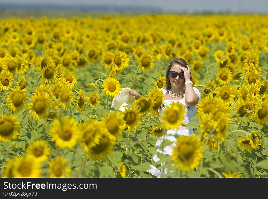 Beautiful woman on sunflower field