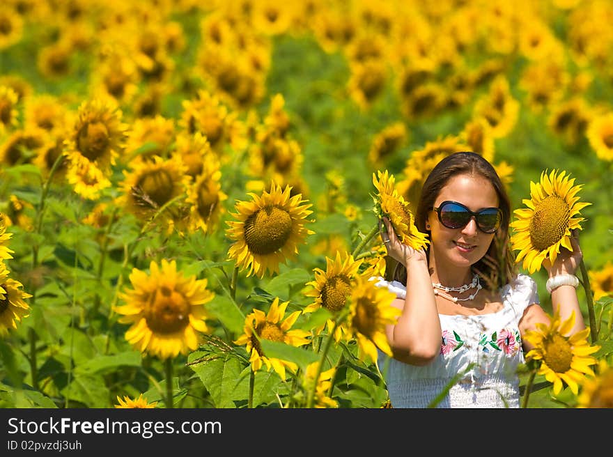 Beautiful woman on sunflower field