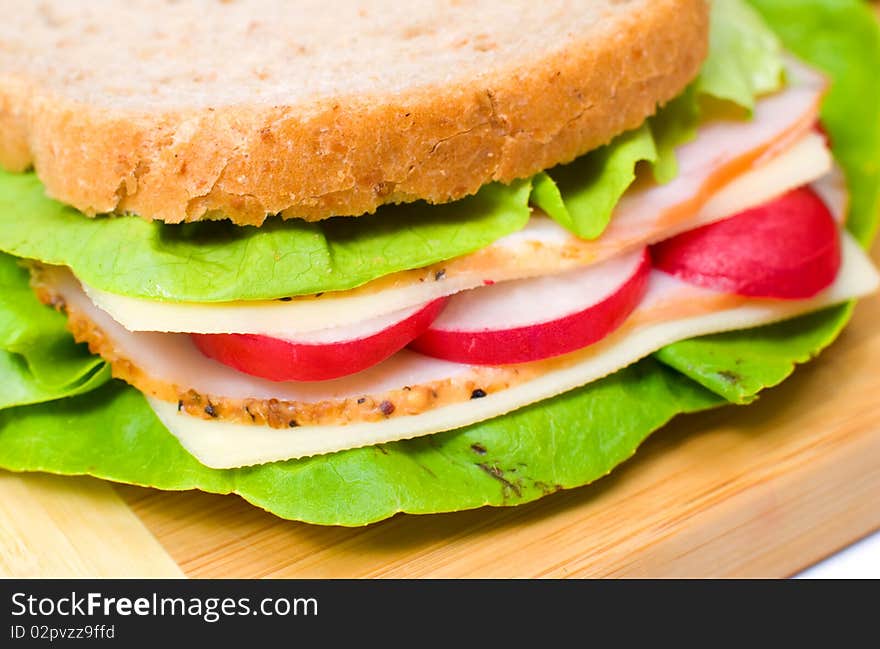 Big and tasty sandwich on a white plate