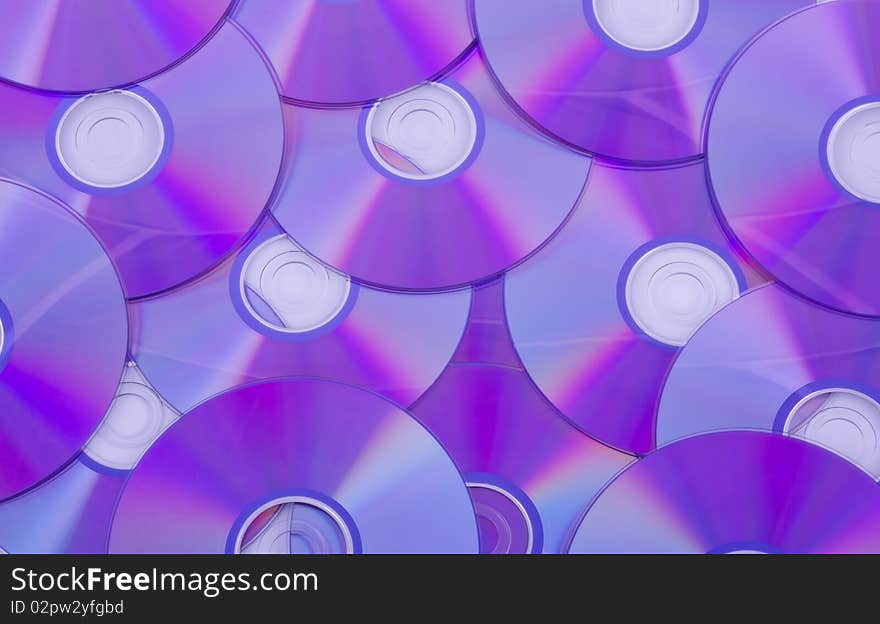 A background consisting of layer of СD disks. A background consisting of layer of СD disks