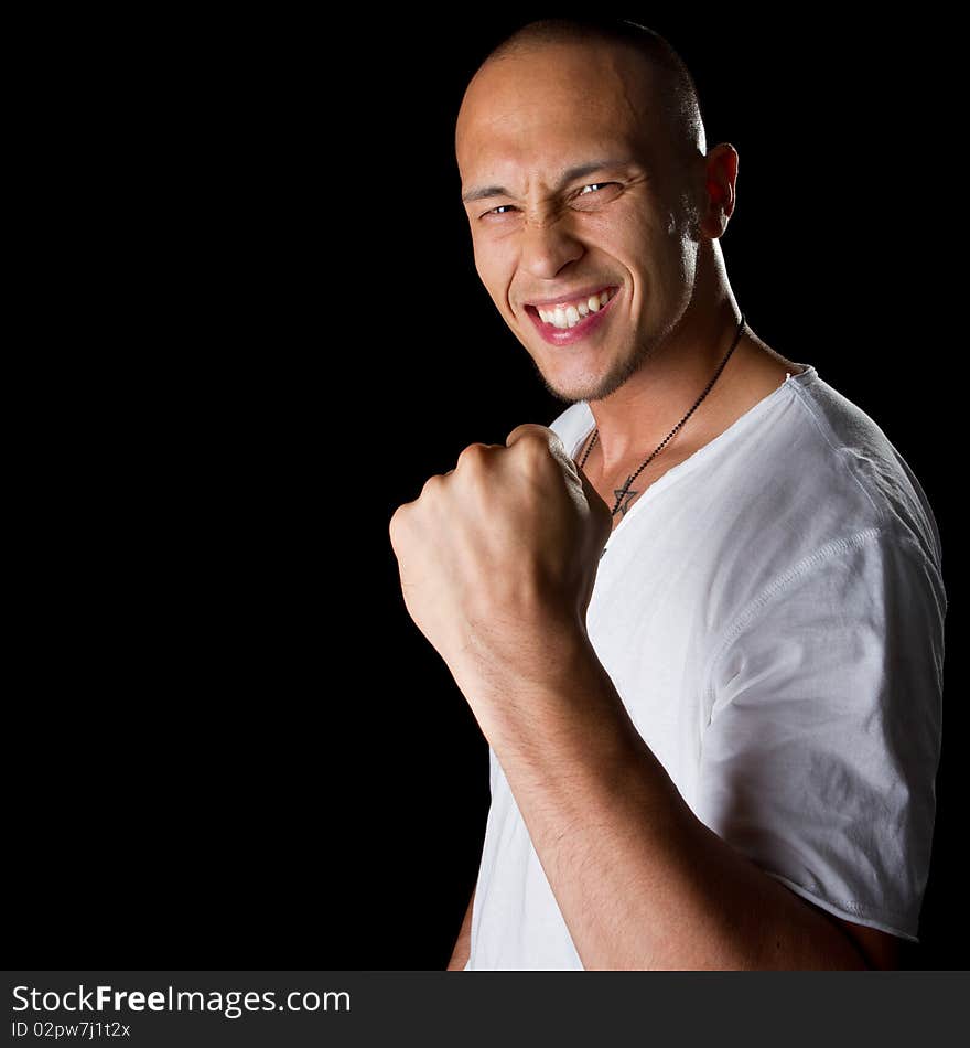 Young male filipino model over a black background is gesturing with his hand. Young male filipino model over a black background is gesturing with his hand.