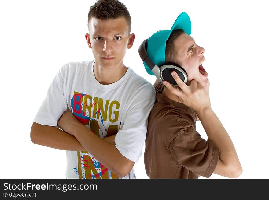 Two young fresh teenagers acting as djs at a party scene. Isolated over white. Two young fresh teenagers acting as djs at a party scene. Isolated over white.