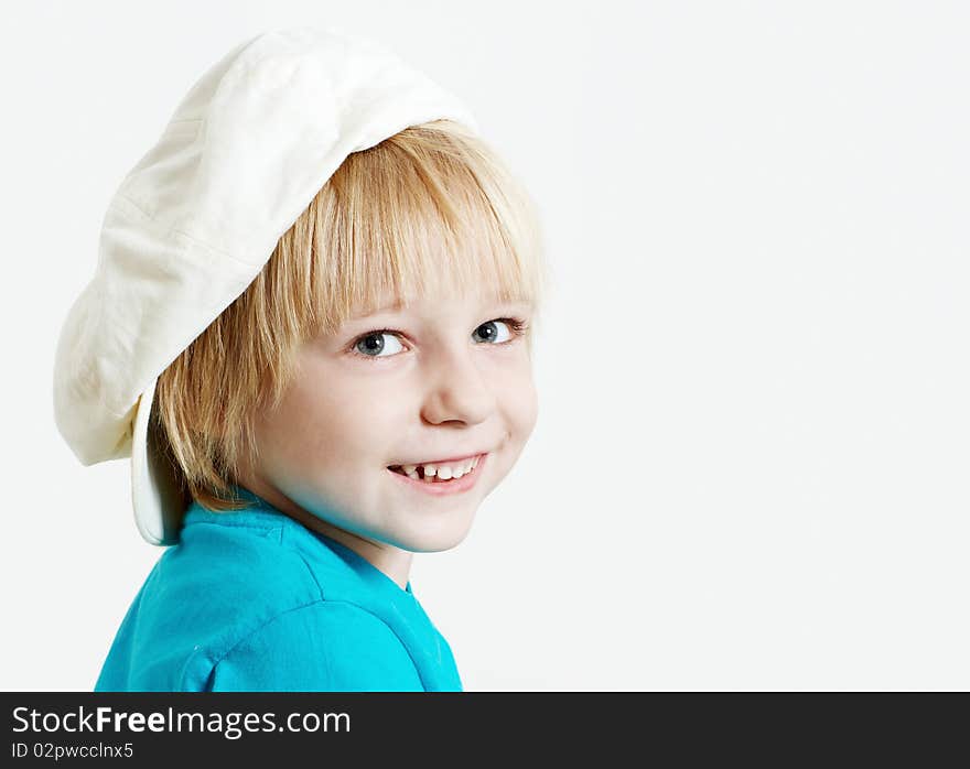 Portrait boy in cap on a light  background