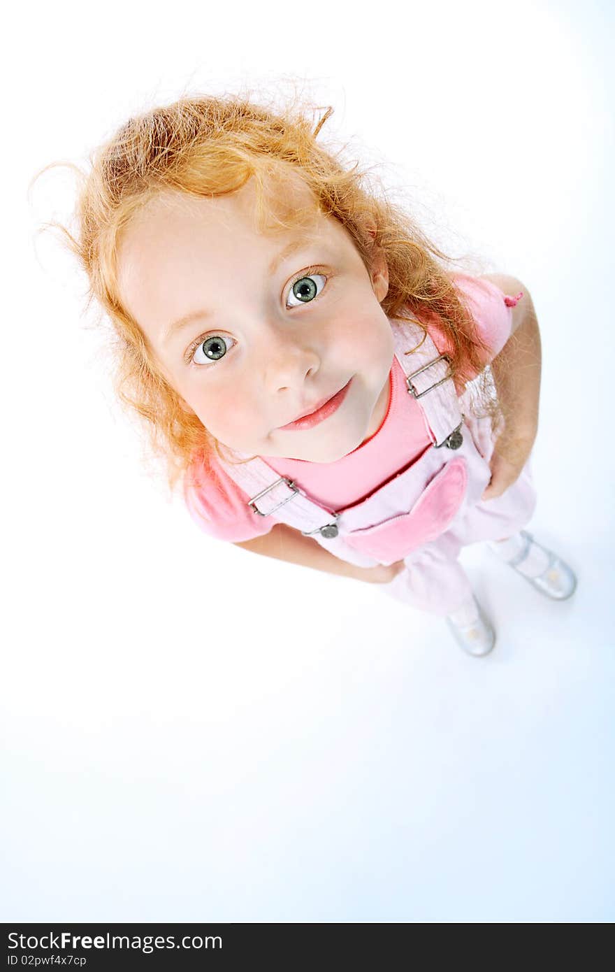 Portrait of a cute red-haired girl. Isolated over white background.