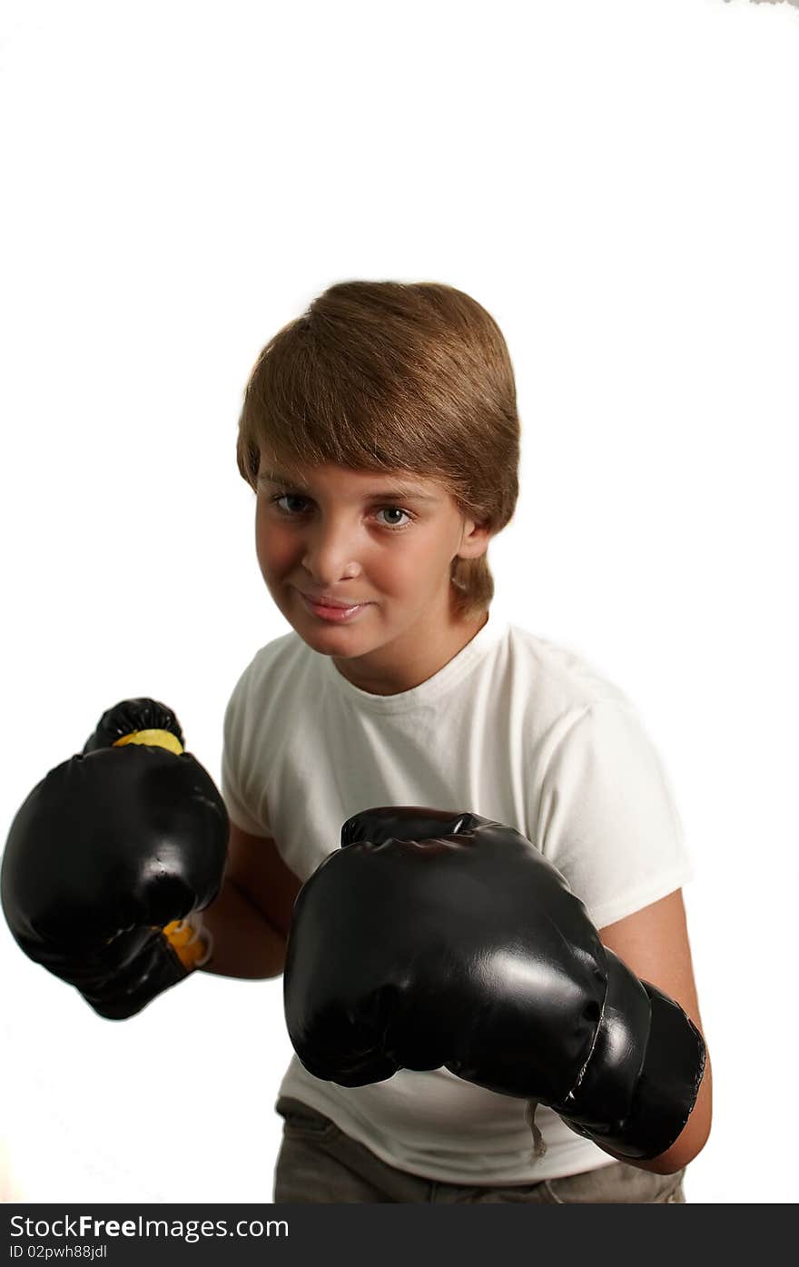 The boy in boxing gloves on a white background . The boy in boxing gloves on a white background .