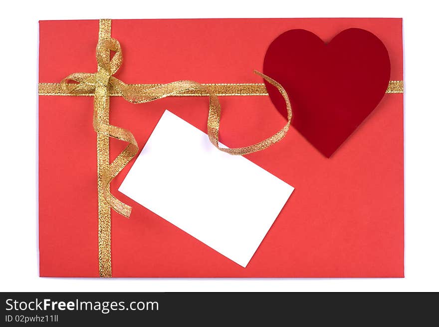 Red blank note and golden ribbon isolated on white background for Valentine's Day