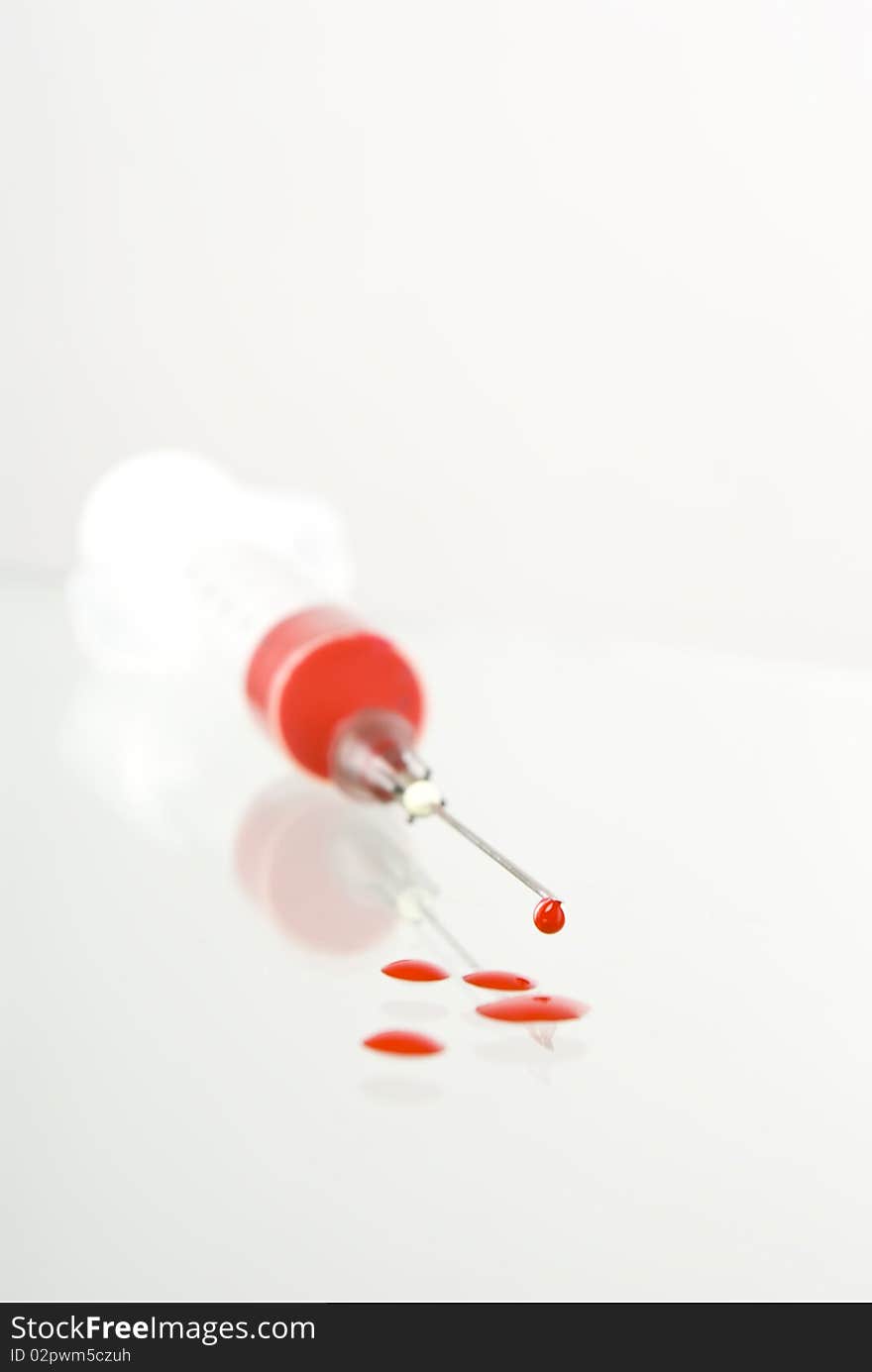 Photo of Medical Syringe on vignetted background