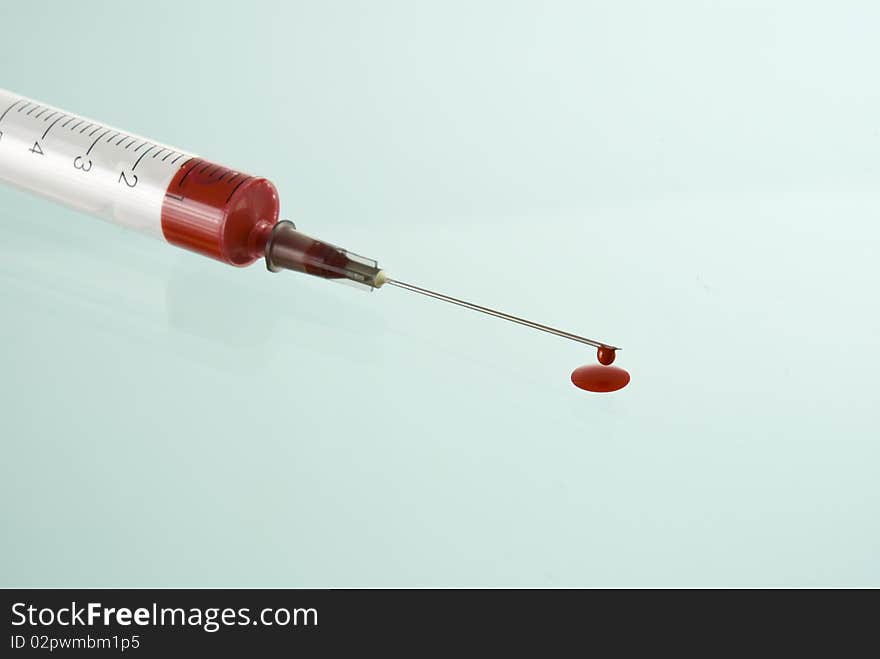 Photo of Medical Syringe on blue  background